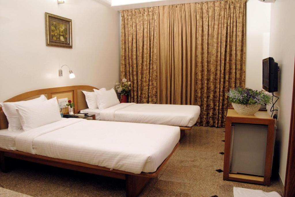 The Ambience Hotel Πούνε Δωμάτιο φωτογραφία