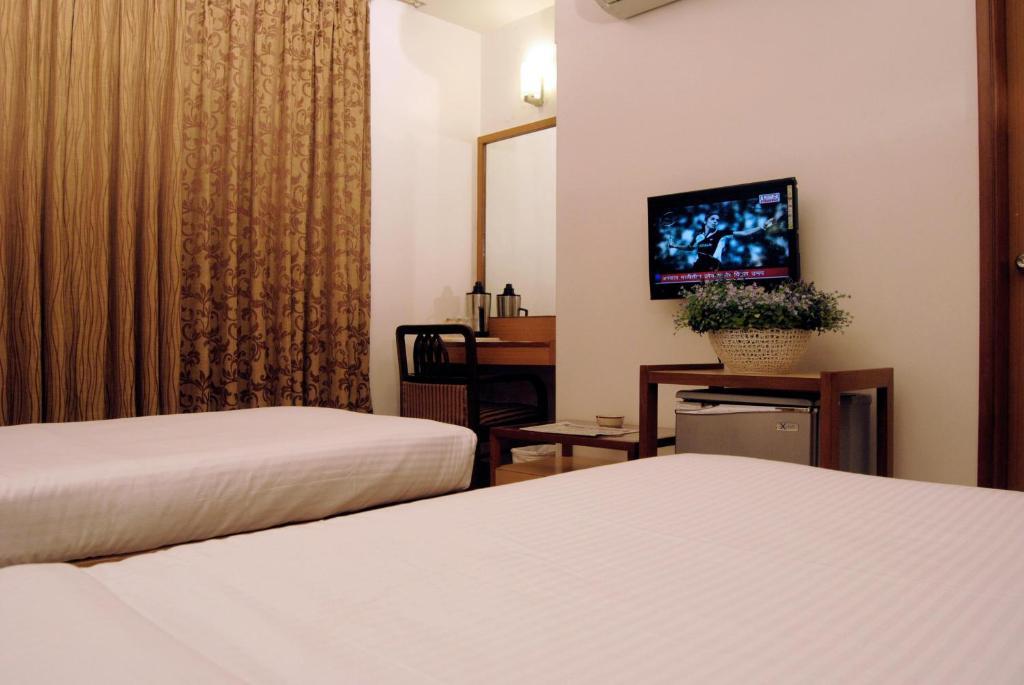 The Ambience Hotel Πούνε Δωμάτιο φωτογραφία